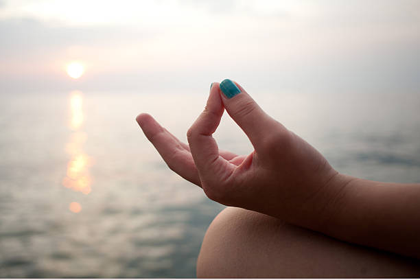 istock Meditating by the sea 158882676