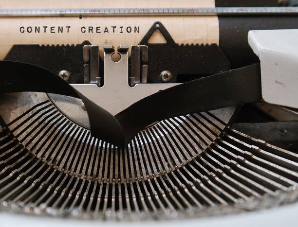 istock Vintage typewriter with text typed CONTENT CREATION, concept of  information contribution, planning and creating useful and effective content to digital media for audience in specific topic 1588853237