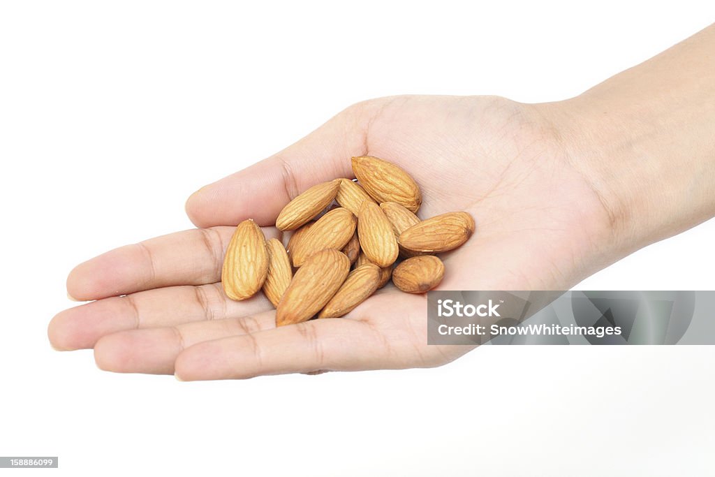 Handful of almonds Handful of almonds against white background Almond Stock Photo