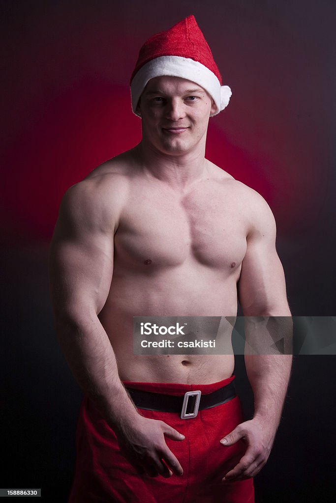 Babbo Natale muscolare - Foto stock royalty-free di A petto nudo