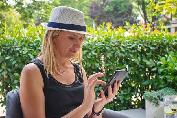 istock Mature woman texting on the mobile phone 1588872170