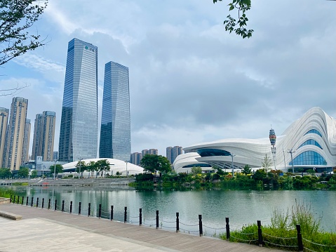 August 2, 2023- Changsha, Hunan, China: Changsha is the capital of Hunan Province, central China. Meixi Lake is a fast growing new area in Changsha and becomes the innovative landmark. Here is Meixi Lake International Culture & Arts Center Theater, designed by the legendary designer- Zaha Hadid, in the background of Jinmao Plaza, the highest twin towers in the area.