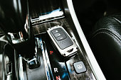 Car keyless entry remote on the auto transmission panel.