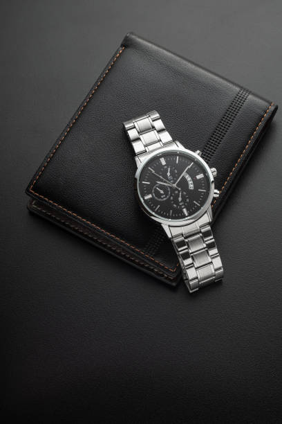 istock Luxury white chrome watch on black background 1588927302