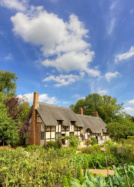 Anne Hathaway's Cottage is a twelve-roomed farmhouse where the wife of William Shakespeare lived as a child in the village of Shottery, Warwickshire, England, about 1 mile west of Stratford-upon-Avon.