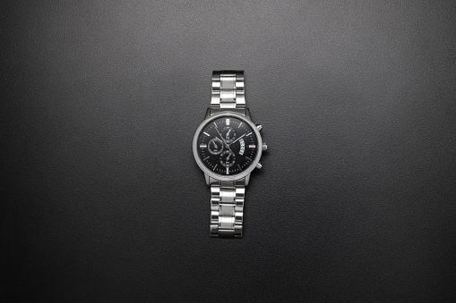 Luxury white chrome watch on black background