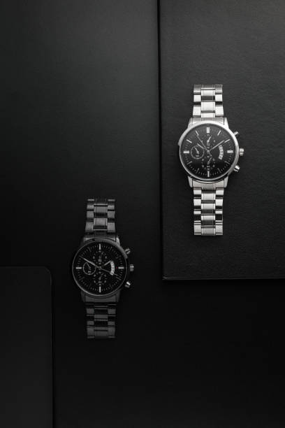 istock Luxury white chrome watch on black background 1588931461