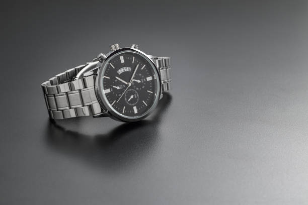 istock Luxury white chrome watch on black background 1588932448