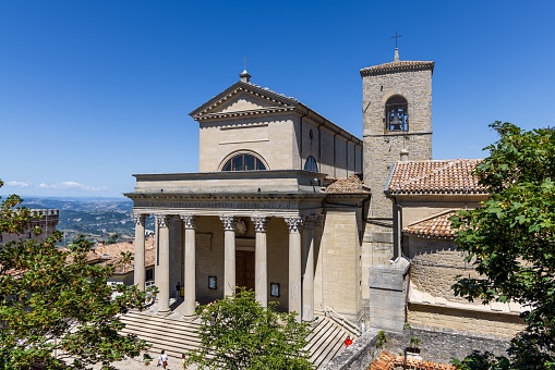 An aerial view of the Basilica of San Marino church situated among a picturesque landscape of mountains