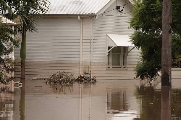 Wooden white house showing signs of flooding Flood  Brisbane  auchenflower area Queensland declared natural disater  queensland floods stock pictures, royalty-free photos & images