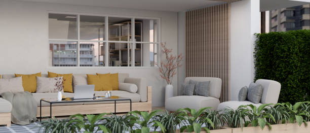 istock Beautiful contemporary home courtyard lounge design with comfortable couch and plants. 1588962194
