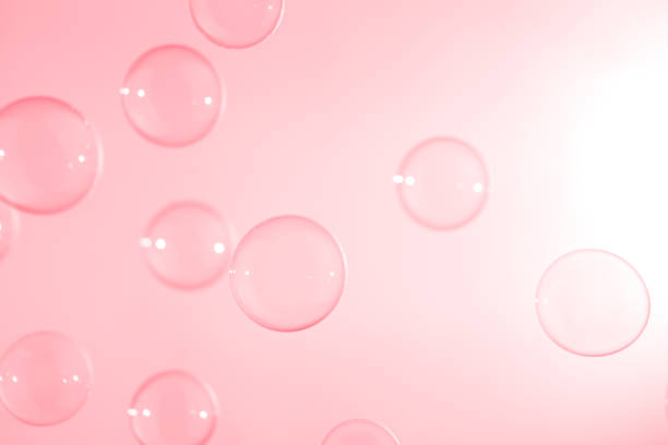 istock Beautiful Transparent Pink Soap Bubbles Floating in The Air. Abstract Background, Pink Textured, Celebration Festive Romance Backdrop, Refreshing of Soap suds, Bubbles Water. 1588997471