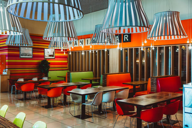 istock Modern restaurant interior with bright red and green design 1589018769
