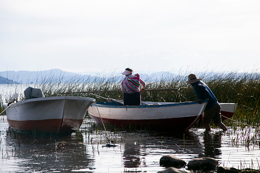Taquile, Peru; 1st January 2023: Local fishermen from the Llachon peninsula working on the shores of Lake Titicaca.