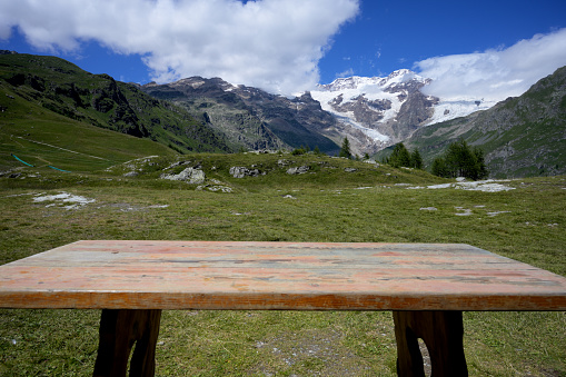 Table with view of Dolomites, European Alps.