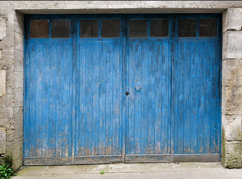 an old rustic blue door, France