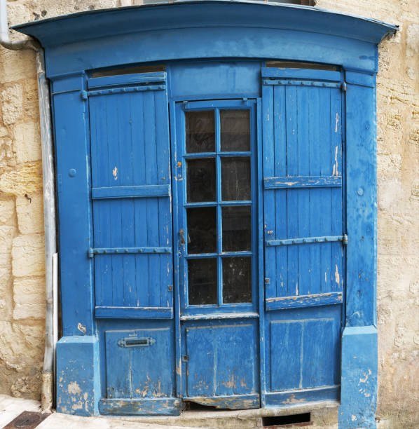 istock old rustic blue door, France 1589071143