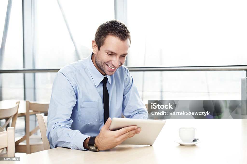 Businessman with digital tablet smiling Digital Tablet Stock Photo