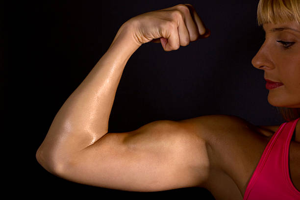 istock Muscular Female Athelte Showing Off Biceps 158908985