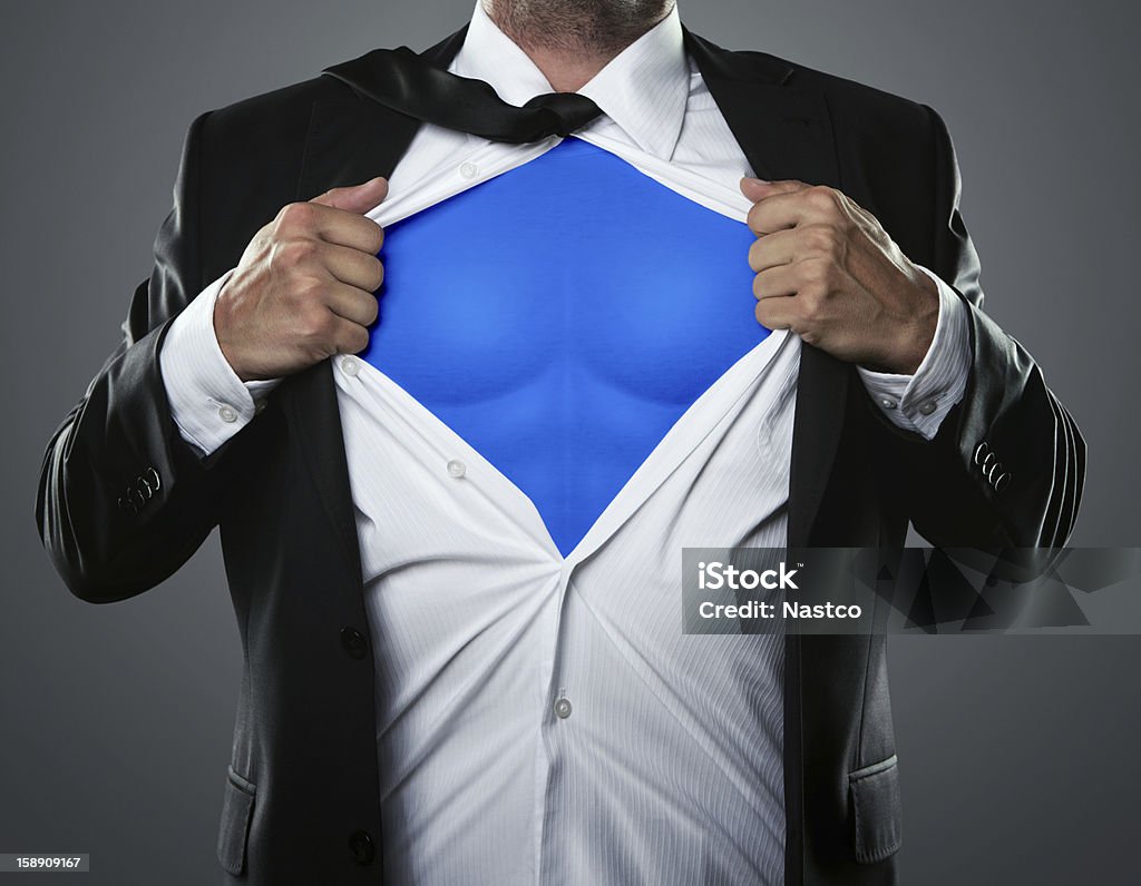 Businessman hero Young businessman acting like a super hero and tearing his shirt off with copy space Superhero Stock Photo