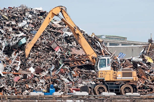istock Crane with magnetic attachment at metal recycling facility 158909325