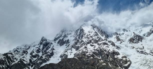 istock nanga parbat under clouds day view, Trishing Valley Rupal Valley, Nanga Parbat Base Camp, Rupal Face ,The beautifull valley of Astore 1589100258