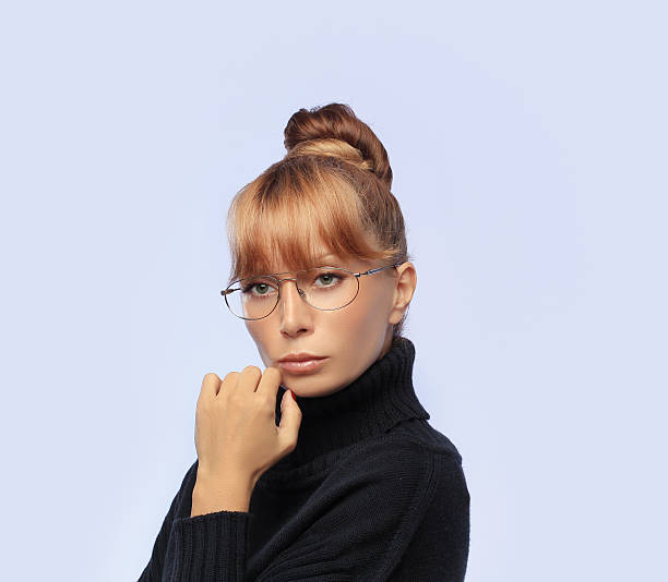istock Beautiful thinking woman wearing glasses,blue background. 158910397
