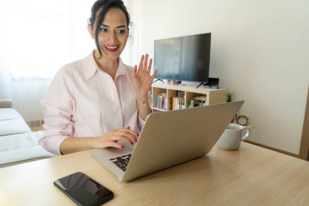 istock young woman using a laptop to make a video call while working from home 1589116670