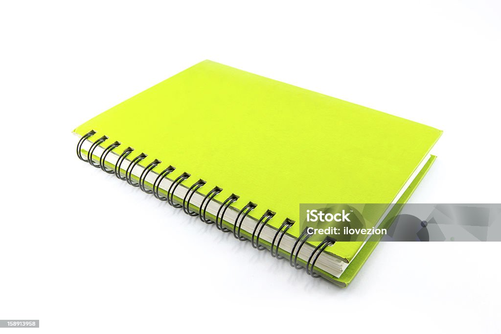 Green Spiral Notebook green spiral notebook isolated on white background with clipping path. Book Stock Photo