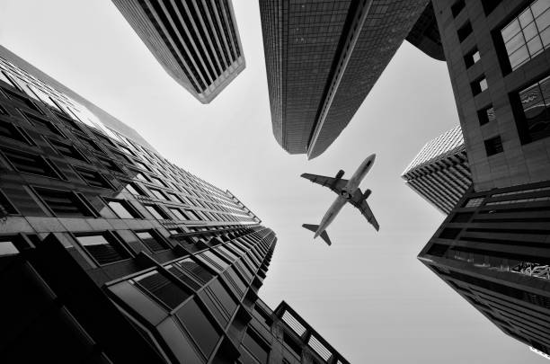 istock Airplane flying over San Francisco skyscrapers. 1589142834