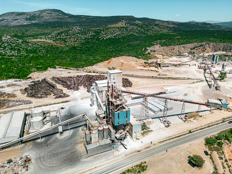 Aerial view of a large limestone quarry and industrial buildings