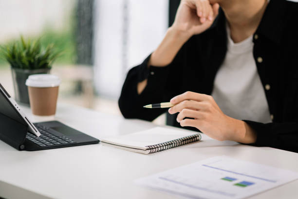 istock businessman working with digital tablet computer and smart phone with financial business strategy layer effect on desk 1589156472