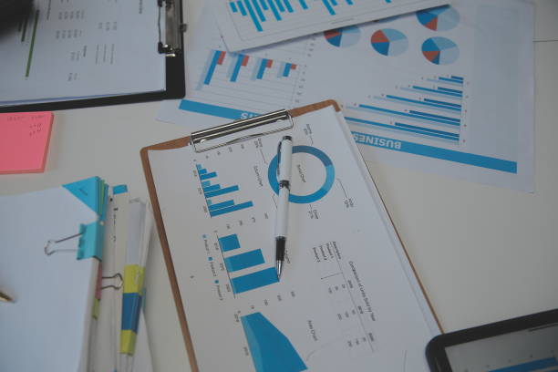 istock Business accounting concept, Business Man using calculator with computer laptop,pen, budget and loan paper in office. 1589164485