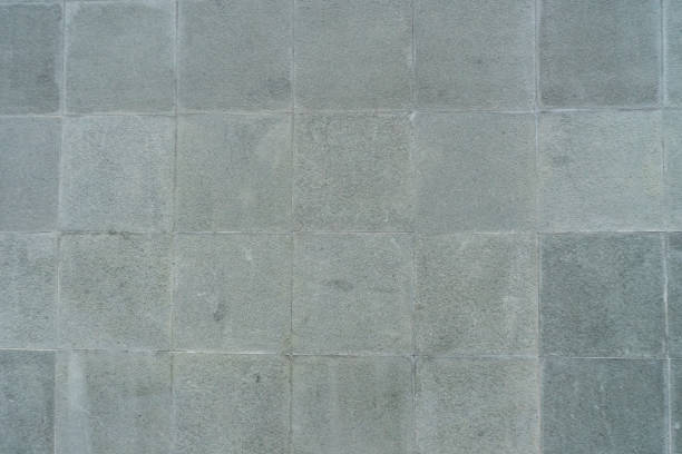 istock Square natural stone tile wall background detail texture 1589193055