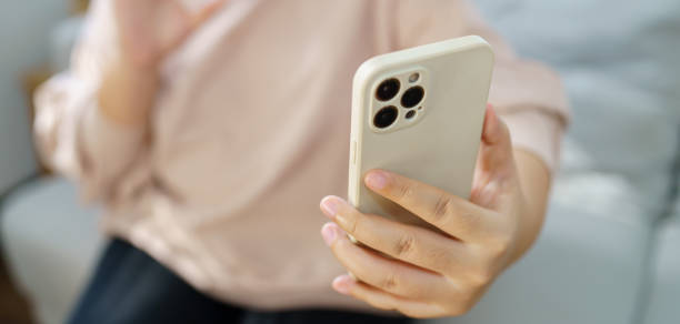 istock Asian woman talking on smart phone have conversation online virtual chat video call with friends. Lifestyle girl vlog video on social media. 1589240971