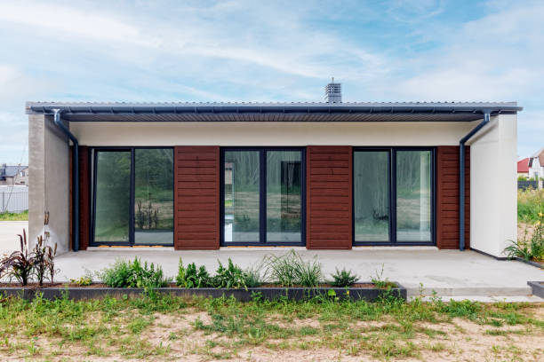 istock View of a small modern house immediately after construction. Step house construction system 1589250055