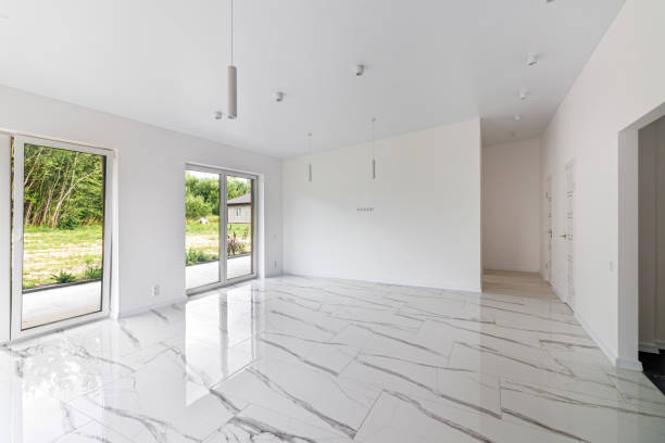 istock Interior of empty apartment, wide room with marble floor 1589251615