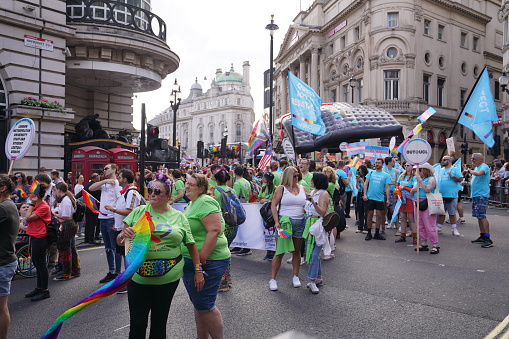 The trans and intersex-inclusive pride flags fly on Regent Street in London, UK. Pride in London 2023 stock photo. The Pride in London - LGBT Parade and street marches took place on Saturday, 1st of July 2023 in various locations in central London, England. Huge crowds turned out for the LGBT+ celebration with a march through the capital. LGBT+ communities and individuals came together again on July 1st 2023 in London, England. Stock photography captured by London-based photographer & photojournalist Can Aksoy.