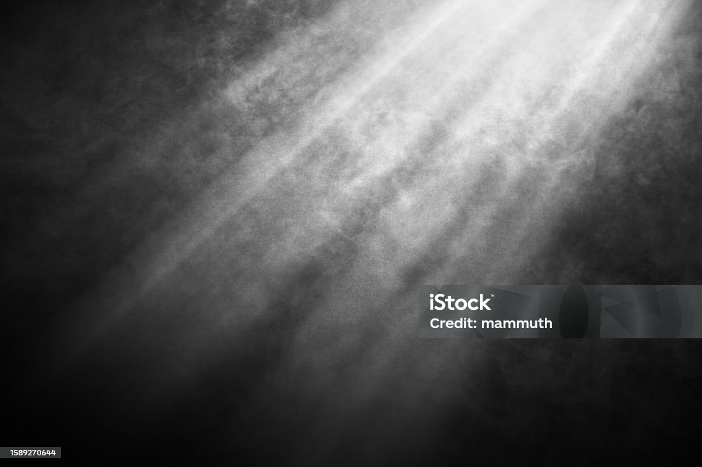 White and gray smoke against black background with light beams Black and white smoke with light rays Smoke - Physical Structure Stock Photo