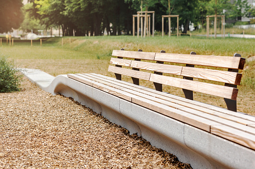 Empty public bench on a sunny day.