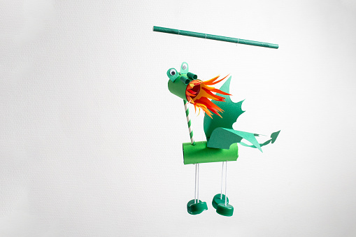 green fire breathing dragon marionette, recycled craft, DIY, easy Chinese New Year Crafts and ideas for kids