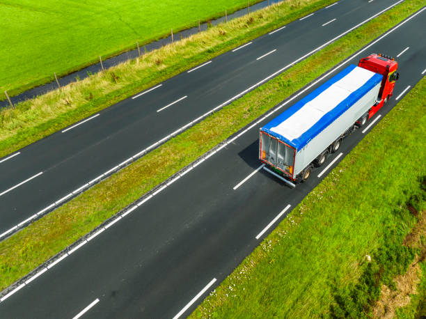 istock Traffic on a highway in the countryside seen from above 1589290833