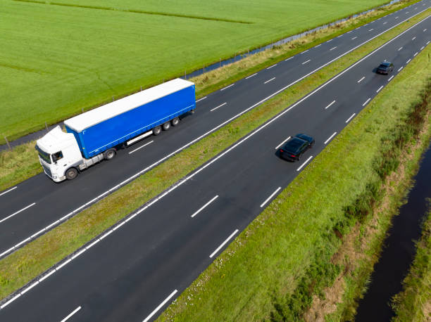 istock Traffic on a highway in the countryside seen from above 1589290859