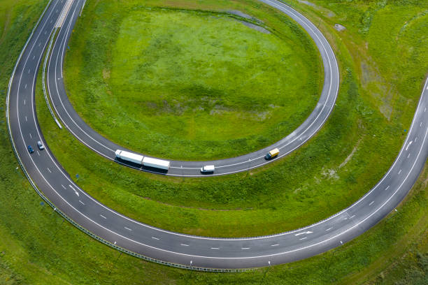 Long exposure of traffic during the day, on a motorway, pasing through the countryside