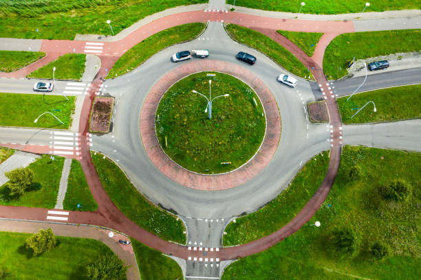 istock Traffic driving over a roundabout seen from above 1589291921