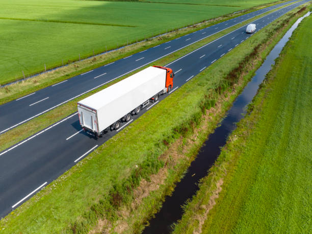 istock Traffic on a highway in the countryside seen from above 1589292986