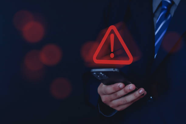 istock Businessman or employee with three warning signs 1589339436