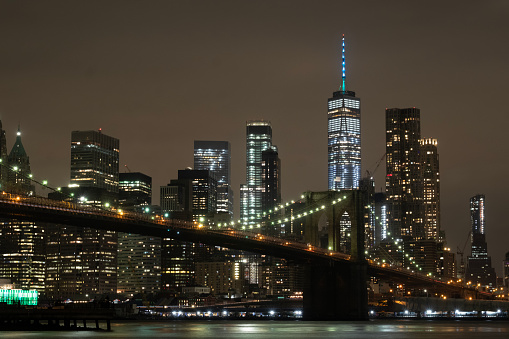 New York City skyline and Brooklyn Bridge at night