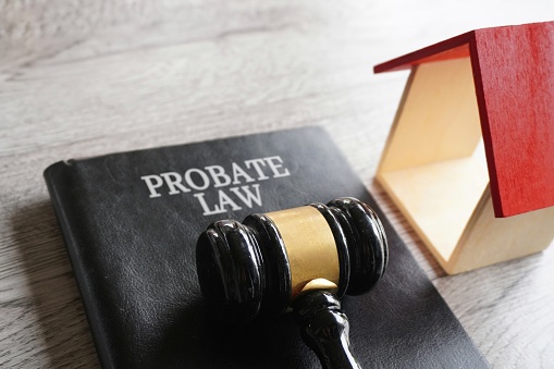 Toy house, gavel and text PROBATE LAW. Real estate and law concept