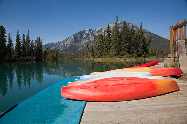istock Bright Colored Canoes by The Bow River 158935913